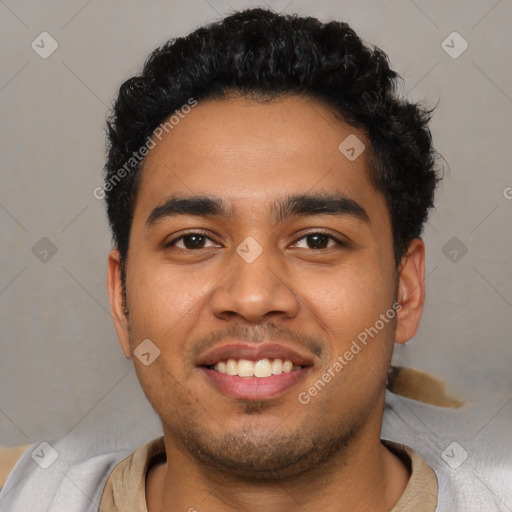 Joyful latino young-adult male with short  black hair and brown eyes