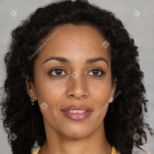 Joyful black young-adult female with long  brown hair and brown eyes