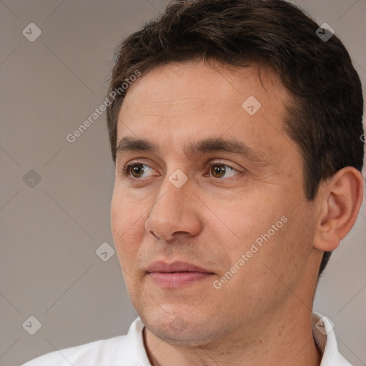 Joyful white adult male with short  brown hair and brown eyes