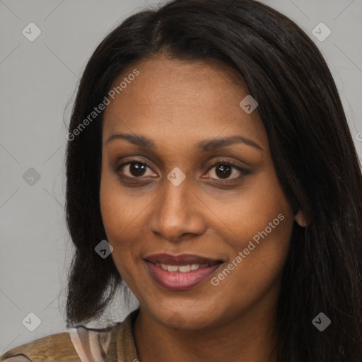 Joyful black young-adult female with long  black hair and brown eyes