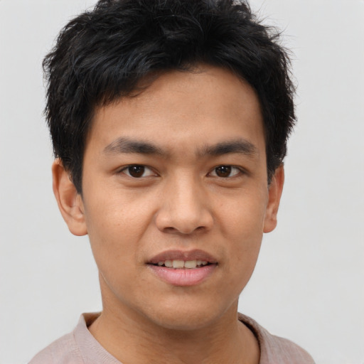 Joyful asian young-adult male with short  brown hair and brown eyes