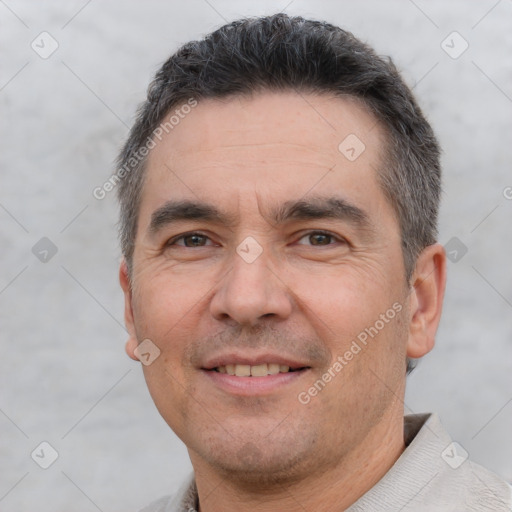 Joyful white adult male with short  brown hair and brown eyes