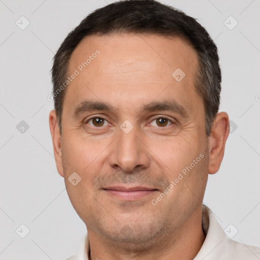 Joyful white adult male with short  brown hair and brown eyes