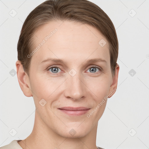 Joyful white young-adult female with short  brown hair and grey eyes