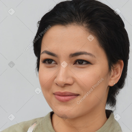 Joyful asian young-adult female with medium  brown hair and brown eyes