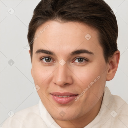 Joyful white young-adult female with short  brown hair and brown eyes