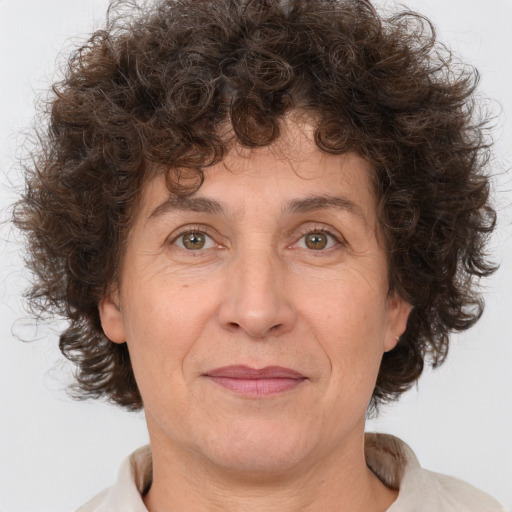 Joyful white middle-aged female with medium  brown hair and brown eyes