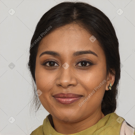 Joyful black young-adult female with medium  brown hair and brown eyes