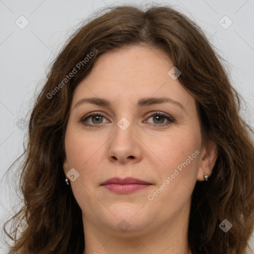 Joyful white young-adult female with long  brown hair and green eyes