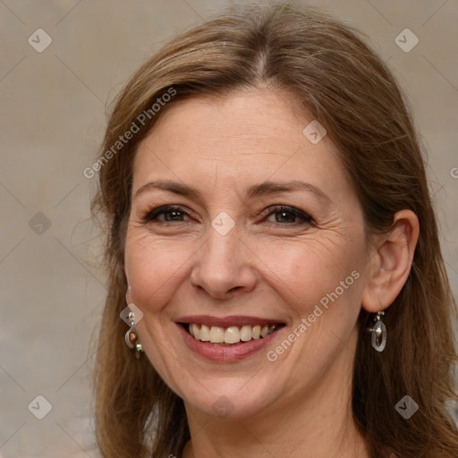 Joyful white adult female with medium  brown hair and brown eyes