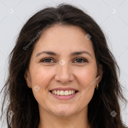 Joyful white adult female with long  brown hair and brown eyes