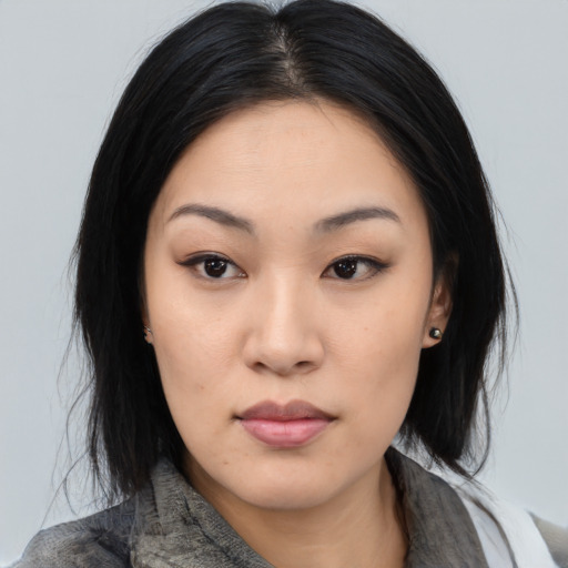 Neutral asian young-adult female with medium  black hair and brown eyes
