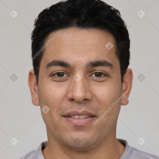 Joyful white young-adult male with short  black hair and brown eyes