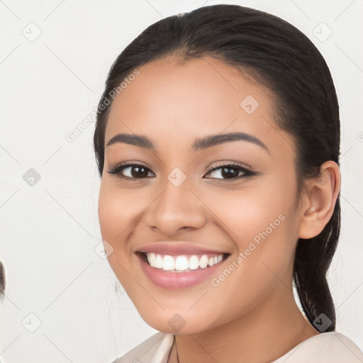 Joyful white young-adult female with long  black hair and brown eyes