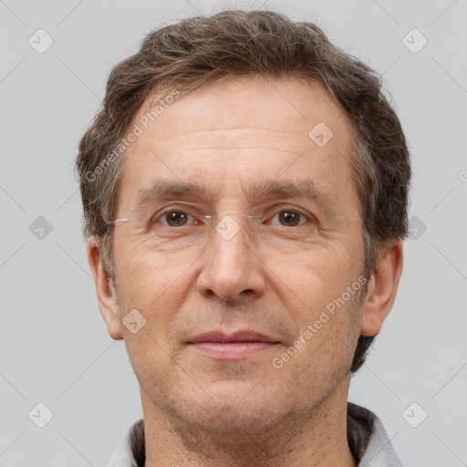 Joyful white adult male with short  brown hair and brown eyes