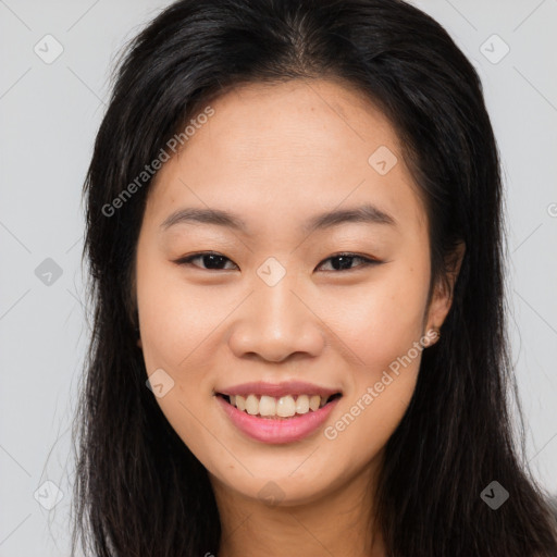 Joyful asian young-adult female with long  brown hair and brown eyes