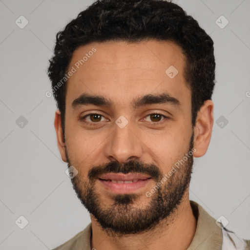 Joyful white young-adult male with short  black hair and brown eyes