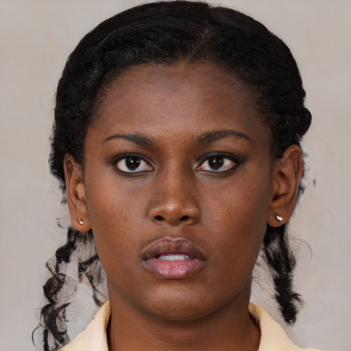 Neutral black young-adult female with medium  brown hair and brown eyes