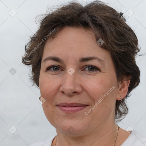 Joyful white adult female with short  brown hair and brown eyes