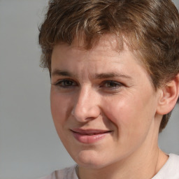 Joyful white young-adult male with medium  brown hair and brown eyes