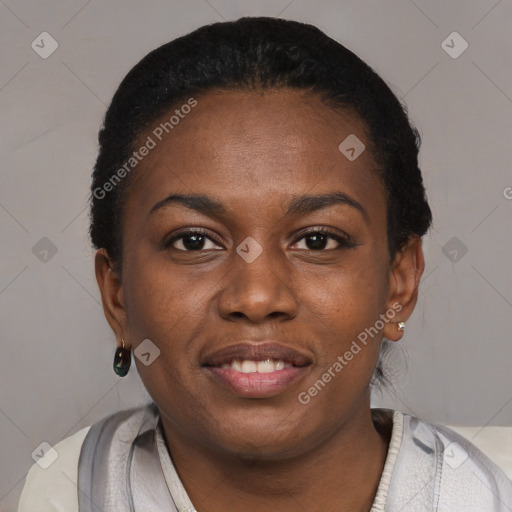 Joyful black young-adult female with short  black hair and brown eyes