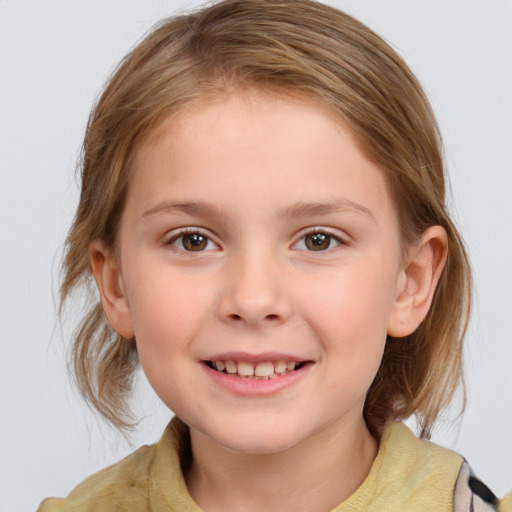 Joyful white child female with medium  brown hair and grey eyes