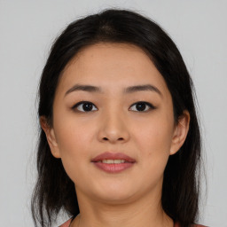 Joyful asian young-adult female with medium  brown hair and brown eyes