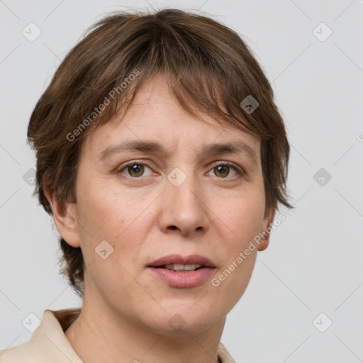 Joyful white adult female with short  brown hair and grey eyes