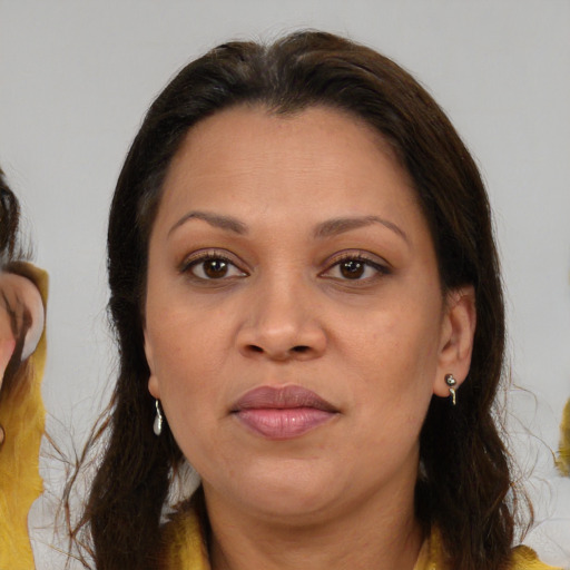 Joyful white adult female with medium  brown hair and brown eyes
