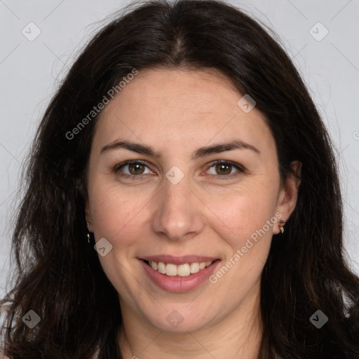 Joyful white adult female with long  brown hair and brown eyes