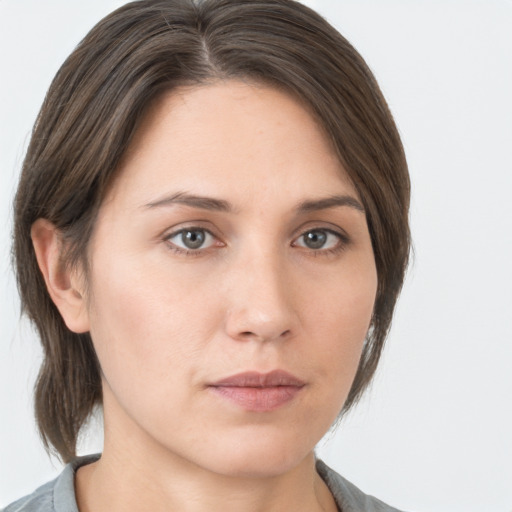 Neutral white young-adult female with medium  brown hair and grey eyes