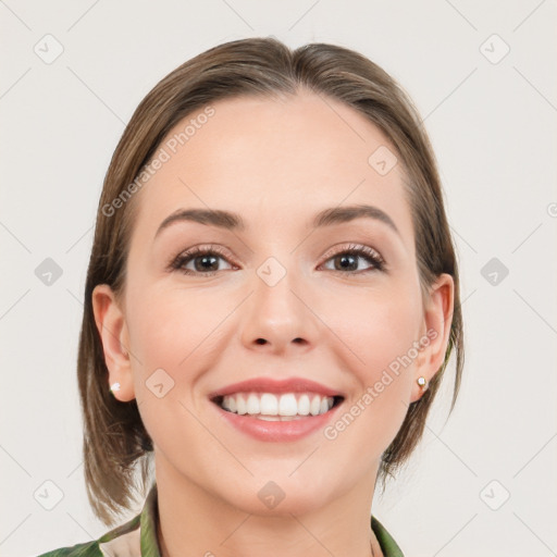 Joyful white young-adult female with medium  brown hair and green eyes