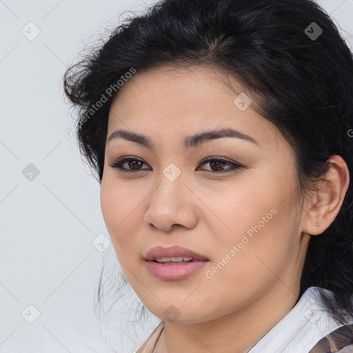 Joyful asian young-adult female with medium  brown hair and brown eyes