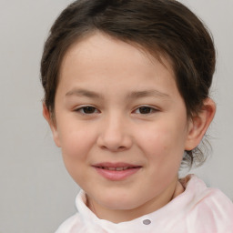 Joyful white child female with short  brown hair and brown eyes