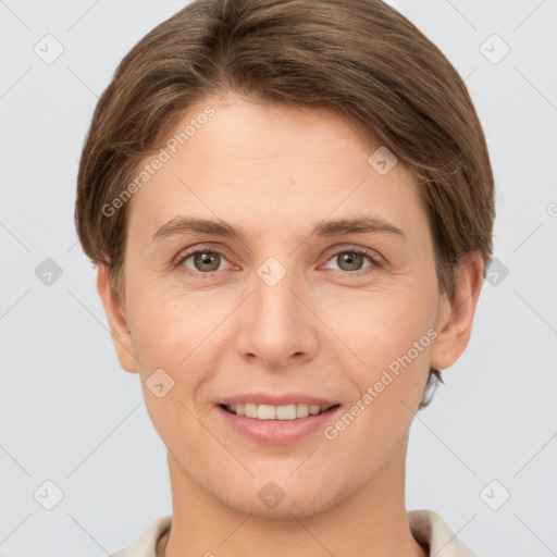 Joyful white young-adult female with short  brown hair and grey eyes