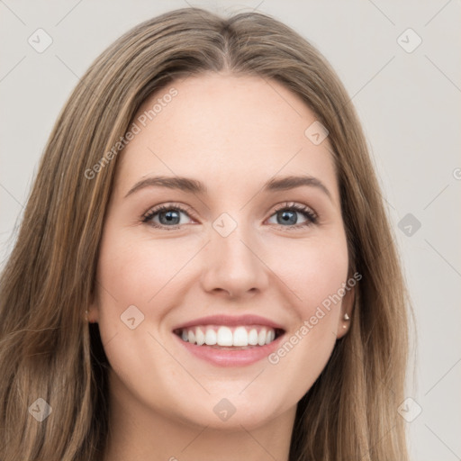 Joyful white young-adult female with long  brown hair and green eyes