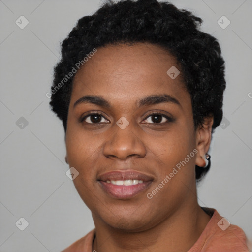 Joyful black young-adult female with short  black hair and brown eyes