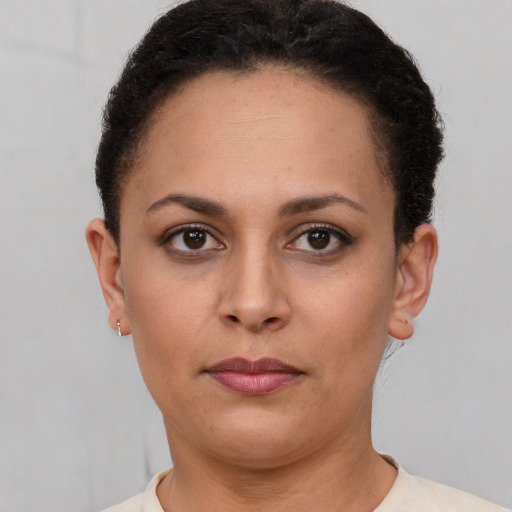 Neutral latino young-adult female with short  brown hair and brown eyes