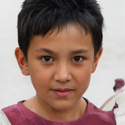 Joyful white child male with short  brown hair and brown eyes