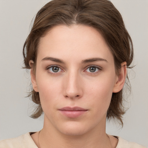 Neutral white young-adult female with medium  brown hair and grey eyes