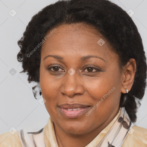 Joyful black adult female with medium  brown hair and brown eyes