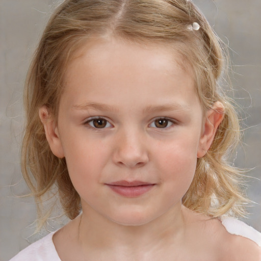 Joyful white child female with medium  brown hair and brown eyes