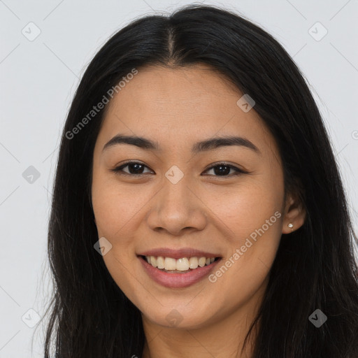 Joyful asian young-adult female with long  brown hair and brown eyes