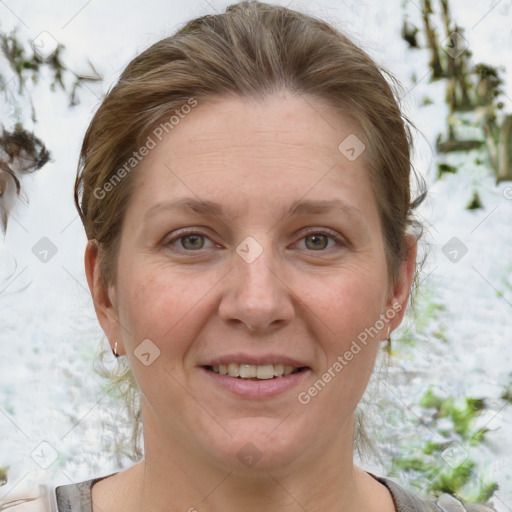 Joyful white adult female with medium  brown hair and grey eyes