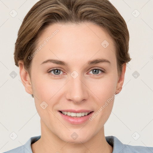 Joyful white young-adult female with short  brown hair and grey eyes