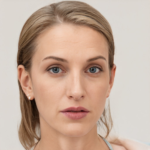 Neutral white young-adult female with long  brown hair and grey eyes