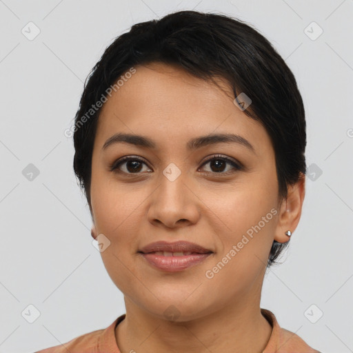 Joyful latino young-adult female with short  brown hair and brown eyes