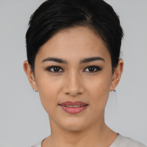 Joyful asian young-adult female with short  black hair and brown eyes
