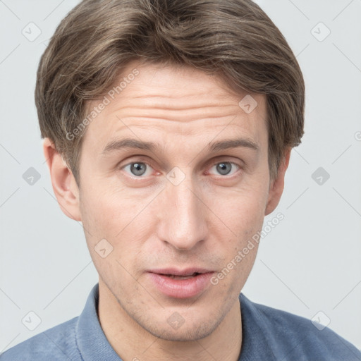 Joyful white adult male with short  brown hair and grey eyes