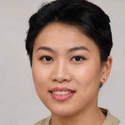 Joyful asian young-adult female with short  brown hair and brown eyes